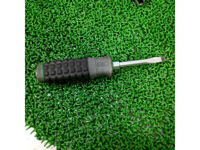 Unknown Manufacturer
Through flat-blade screwdriver