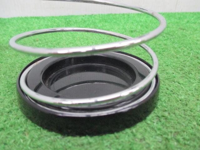 Treasure discovered, manufacturer unknown.
Drink holder