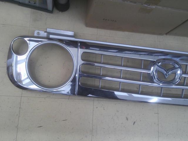 Mazda
Genuine front grille for Spiano HE21S