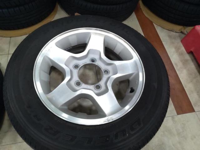 スズキ純正(SUZUKI)  JB23W ジムニー 純正アルミホイール  + BRIDGESTONE(ブリヂストン) DUELER H/L 