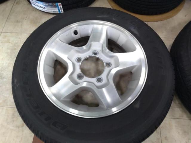 スズキ純正(SUZUKI)  JB23W ジムニー 純正アルミホイール  + BRIDGESTONE(ブリヂストン) DUELER H/L 