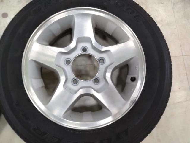 スズキ純正(SUZUKI)  JB23W ジムニー 純正アルミホイール  + BRIDGESTONE(ブリヂストン) DUELER H/L 