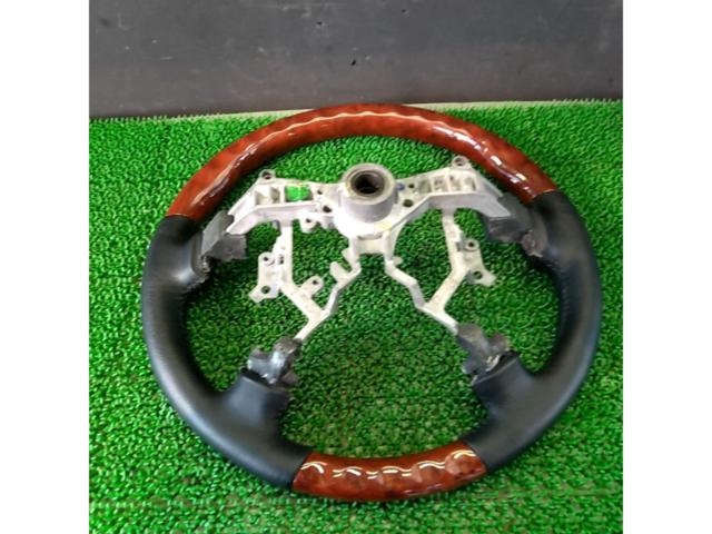 Unknown Manufacturer
Wood combination leather steering wheel