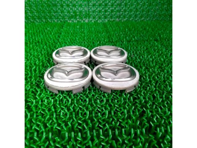 Genuine Mazda center caps removed from an Atenza.