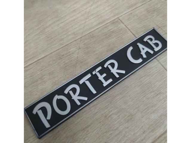  time thing 
Mazda (PORTER
CAB
Porter Cab emblem