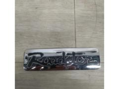  time thing 
Mazda Roadster
Roadster emblem