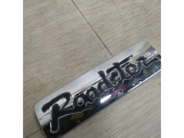  time thing 
Mazda Roadster
Roadster emblem