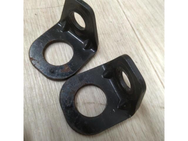 L-shaped bracket for securing a 4-point seat belt.