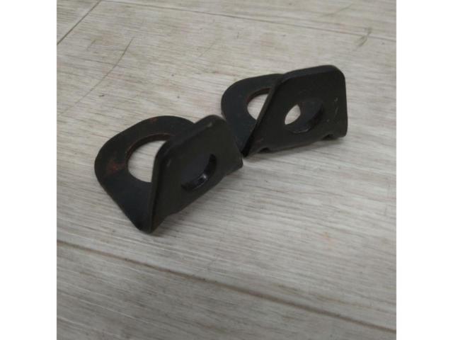 L-shaped bracket for securing a 4-point seat belt.