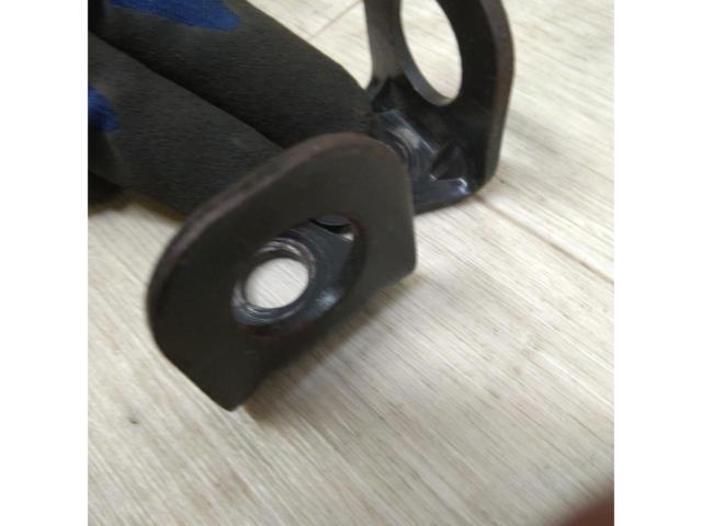 L-shaped bracket for securing a 4-point seat belt.