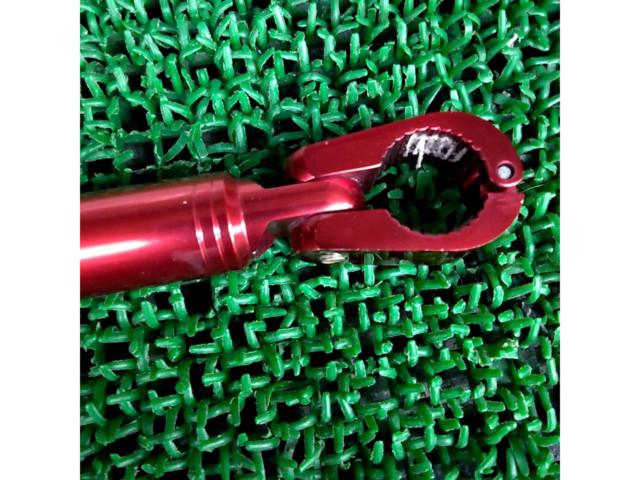Aluminum handlebar brace from an unknown manufacturer.
