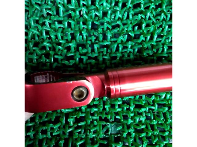 Aluminum handlebar brace from an unknown manufacturer.