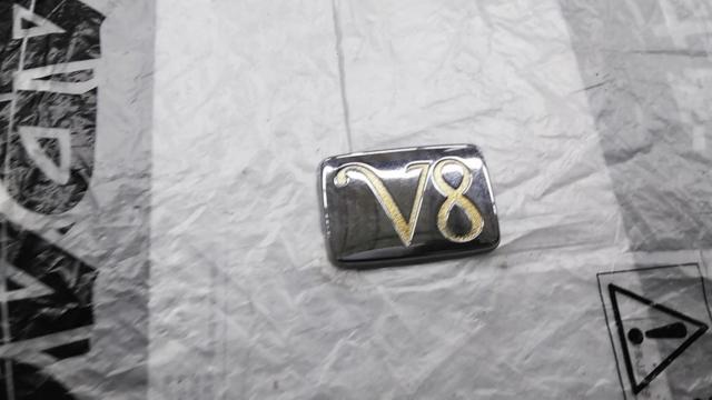 Nissan genuine
Rear trunk emblem
V8