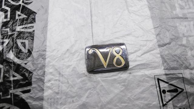 Nissan genuine
Rear trunk emblem
V8